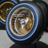 New 14x7" Deep Dish 24kt Gold and Chrome 100 Spoke Wire Spoke Wheels True Knockoff Lowrider Set (4) with 175-70-14 Bluewall Tire Package - Image 2