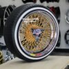 New Set (4) 17x9" Genuine Dayton Brand Stamped & Serialized 24kt Gold & Chrome 100 Spoke Triple Cross Lace One Of A Kind knockoff Wire Wheels & Low Profile Whitewall Tires - Image 2