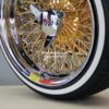 New Set (4) 17x9" Genuine Dayton Brand Stamped & Serialized 24kt Gold & Chrome 100 Spoke Triple Cross Lace One Of A Kind knockoff Wire Wheels & Low Profile Whitewall Tires - Image 7