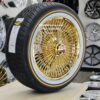 New Set (4) All Gold 17X8" Front Wheel Drive 24kt Gold Bead Lace 100 Spoke True Knockoff Wire Wheels & Vogue Whitewall Yellow Gold Stripe Tire Package (4) WITH HARDWARE - Image 2