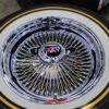 New Set (4) Genuine Dayton 15" & 16" Rear Wheel Drive 100 Spoke Wire Wheels & Vogue Whitewall / Yellow Stripe Tire Package With Choice Of Spinner & Hardware - Image 4